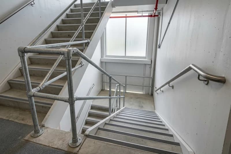 Guardrail and handrail shop drawings showing ADA continuous wall brackets